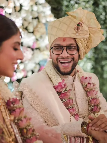 The groom's infectious laughter during the wedding ceremony, a genuine moment of happiness that we love to capture.