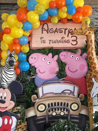 We love creating mashup themes for kids' parties. This 3rd birthday celebration brought together Peppa Pig, Mickey Mouse, and jungle animals for a fun-filled character party.