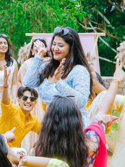 The bride's friends and family sharing a laugh and a dance. Creating a fun, inclusive atmosphere is key to a memorable wedding party.