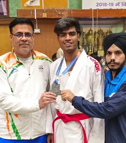 Harshit Pandey receiving his silver medal at the All India Inter University Games, a significant achievement at a highly competitive event.