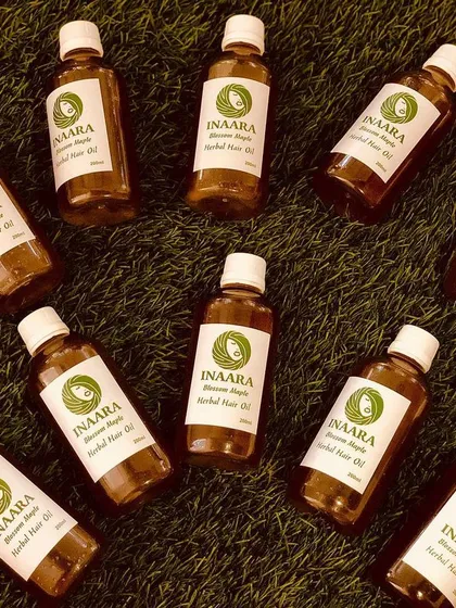 Bottles of my Blossom Maple hair oil, ready for you. This formula is specifically designed to help with baldness, patches, and promoting strong root-to-tip hair growth.