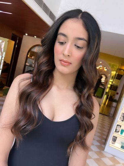 The depth and dimension of this brunette balayage are evident in this shot. The colour looks rich, healthy, and full of life.