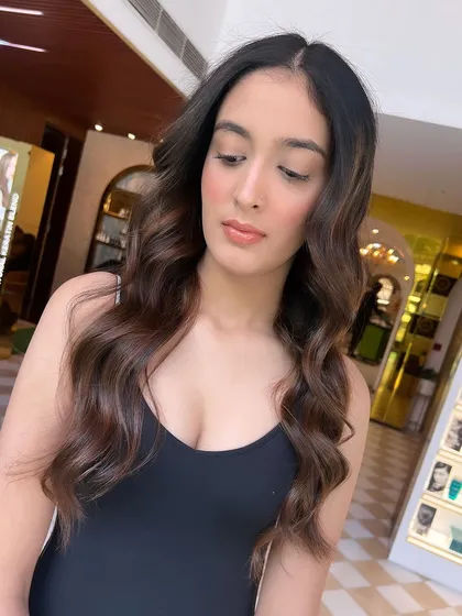 The depth and dimension of this brunette balayage are evident in this shot. The colour looks rich, healthy, and full of life.
