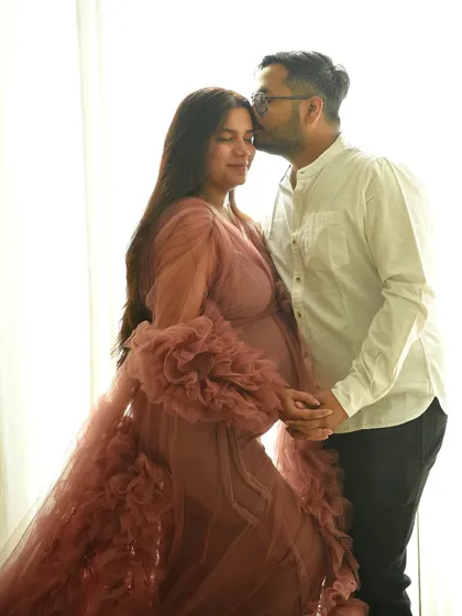 A tender forehead kiss completes this romantic, high-key maternity portrait. These are the simple, loving gestures that I strive to capture in every session.