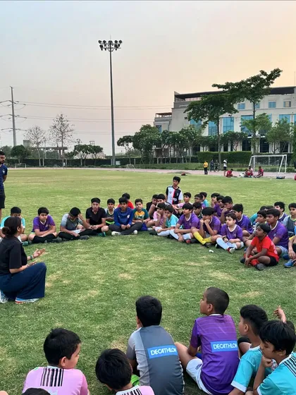 Our players listening intently during a workshop on injury prevention. We teach them how to take care of their bodies for a long and healthy playing career.