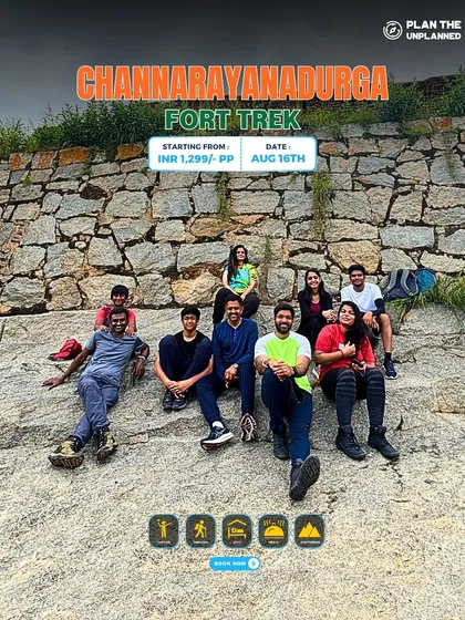 A group sits on the stone base of Channarayanadurga Fort, a great option for a one-day historical hike.
