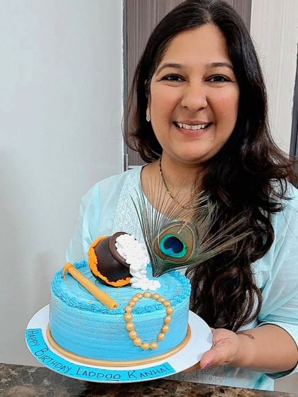 Me holding one of my favorite Janmashtami cake designs. Blessed to create for this auspicious day.