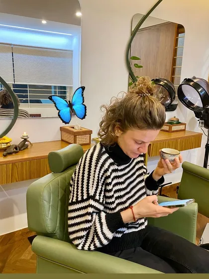 A client from France enjoying our iconic Ayurvedic detox tea before her Abhyanga full body massage. Her journey to us began with a search for authentic spiritual and wellness experiences in India.