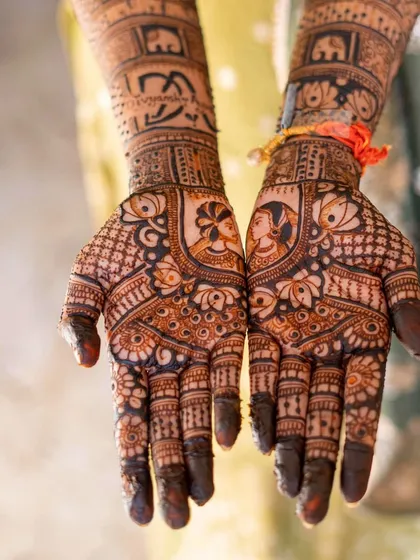 A close-up of a beautiful bridal design, showing the intricate details and the rich color of the henna.
