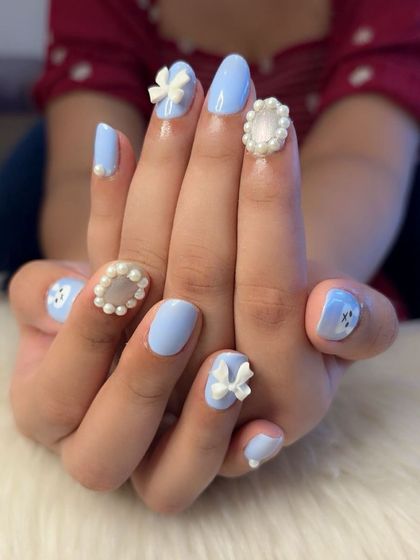 Both hands together, showcasing the playful and elegant coquette design.