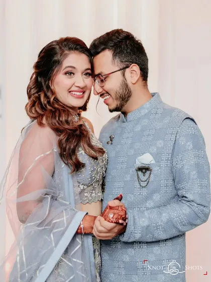 The look of love. This candid shot captures the groom's adoration and the bride's happy smile during their engagement photos.