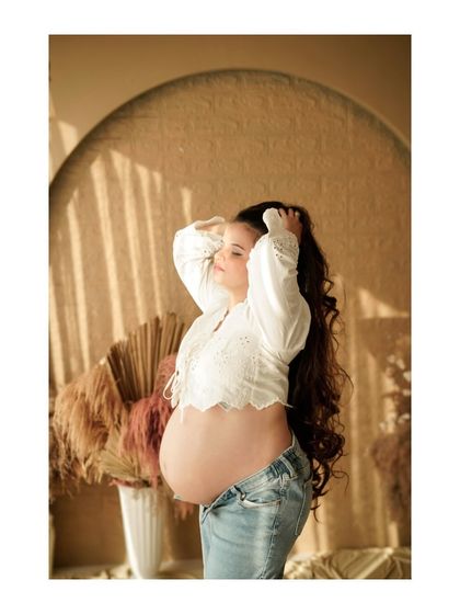 A relaxed and sun-kissed solo portrait in our boho studio, capturing a moment of pure bliss.