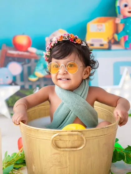 A fun and colorful Cocomelon-themed milk bath. I can incorporate your child's favorite characters into their milestone session.