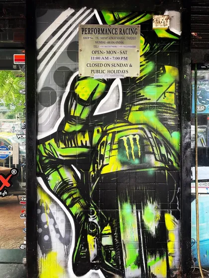 The finished mural integrated into the store's entrance. The artwork now serves as a landmark and a bold welcome to customers.