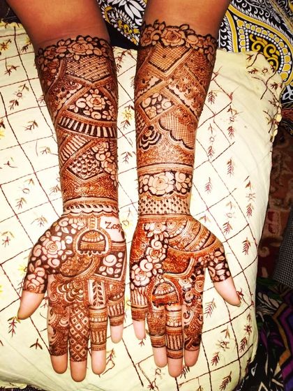 I did this henna for my best friend for her brother's wedding. It features a beautiful jhumka design on the palm and intricate work up the arm, perfect for a close family member.