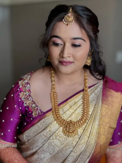 Another angle of Nayana's soft engagement makeup. The focus is on flawless skin and gently defined eyes.