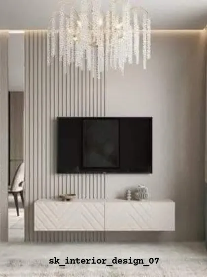 A chic TV unit with a chevron-patterned console and a beautiful crystal chandelier. The slatted partition on the side adds a layer of privacy and texture.