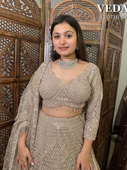 A closer look at the detailed blouse of this pre-loved beige lehenga. The craftsmanship is clear in the delicate patterns and the flattering sweetheart neckline.