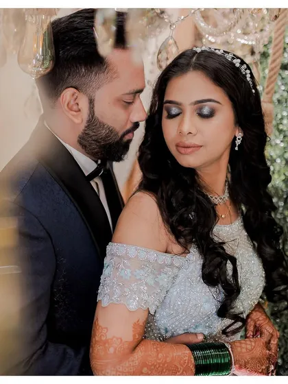 The newlyweds' portrait. Shweta's reception look was a quick 20-minute change from her wedding look into this princess glam style, complete with a smokey eye and sparkling gown.