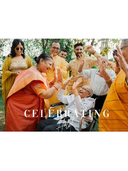 A heartwarming moment of family members, including an elderly person in a wheelchair, celebrating together.