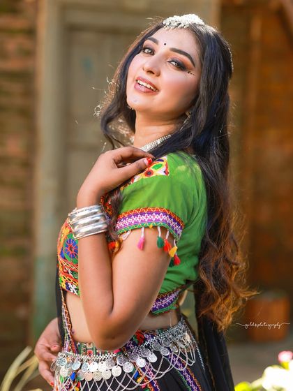 A vibrant and energetic series celebrating Navratri. The model is dressed in colorful Garba attire, and the photos capture the festive spirit through dynamic poses and joyful expressions.