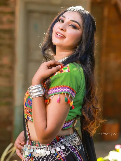 A beautiful portrait from the Navratri series, capturing the model's happy expression and the intricate details of her traditional Garba outfit.
