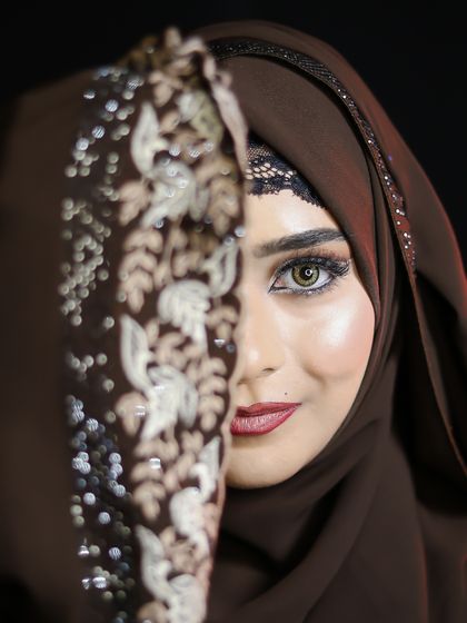 Another artistic half-face shot, highlighting the beautiful hazel eyes and the flawless makeup.