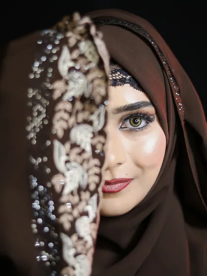 Another artistic half-face shot, highlighting the beautiful hazel eyes and the flawless makeup.