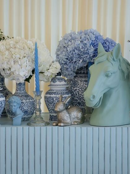 More details from the shelf display, including a horse head sculpture and custom-printed lampshades.