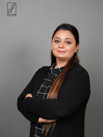 An arms-crossed pose that conveys confidence and expertise.