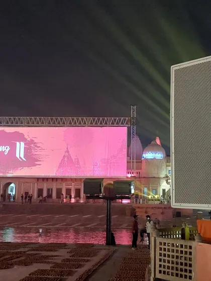 This shot highlights the strategic pairing of a large speaker array with the main LED screen. Placing powerful audio sources near key visual elements ensures a synchronized and impactful experience for the audience, even from a distance.