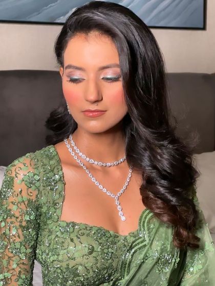 A glamorous open hairstyle with big, voluminous waves. This is a statement look, perfect for a reception or any event where you want to feel like a star.