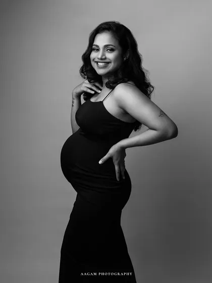 A confident and happy pose. Black is a favorite for maternity sessions as it creates a beautiful, slimming silhouette.