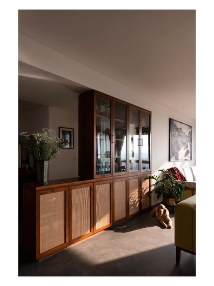 Another view of the custom crockery unit, showing how it helps define the dining area while providing beautiful, functional storage.