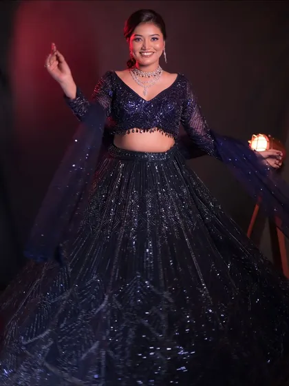This full-length shot shows the incredible sparkle of the all-over sequin work on this purple lehenga. It's pure glamour.