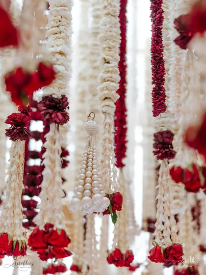 A close-up of the fragrant floral strings, or 'ladis', from the 'Laal Ishq' wedding. We used thousands of rajnigandha, mogra, and roses, a detail that speaks to the heart of traditional Indian wedding decor and craftsmanship.