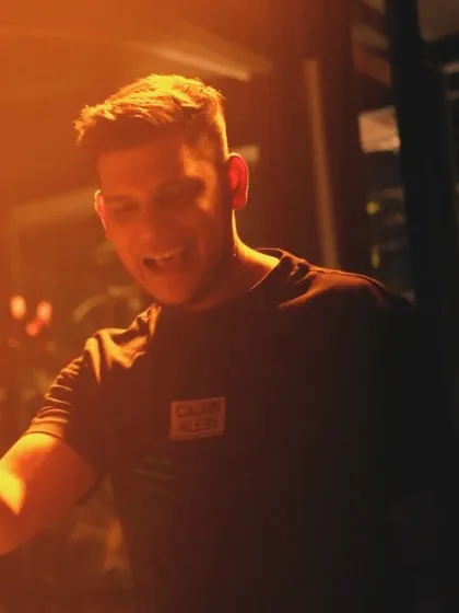 A candid shot of me smiling and enjoying the moment during a set at Raahi.