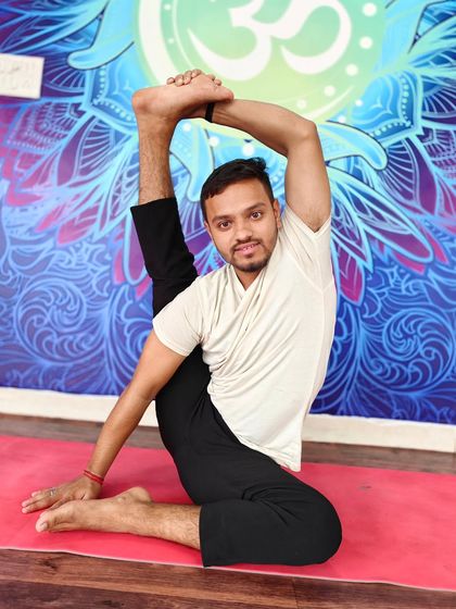 A seated compass pose (Parivrtta Surya Yantrasana), showcasing an incredible hamstring and side-body stretch.