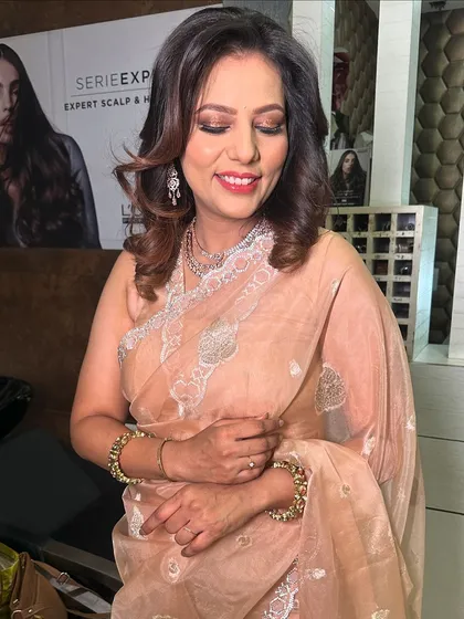 A beautiful look on my staff member. We went for a classic brown smokey eye and soft waves, a timeless look for any party.