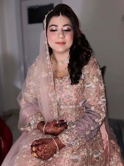 My brides are my pride. This close-up shows the soft glam makeup, with a focus on rosy cheeks and a subtle lip color that enhances her natural beauty.