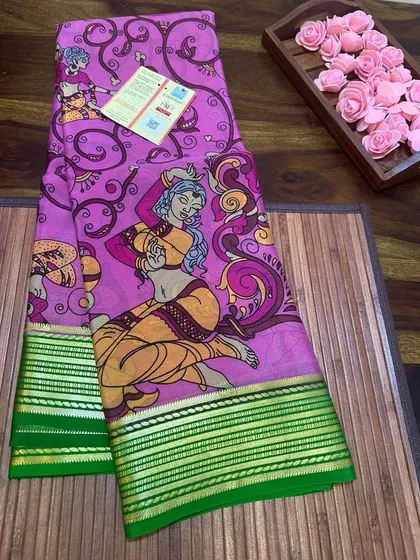 A printed Kalamkari Mysore silk saree with artistic dancing figures and a green border.