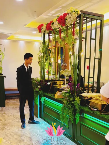My staff ensuring the green and gold buffet is perfectly maintained. We take pride in keeping our displays looking pristine and fully stocked throughout the event.