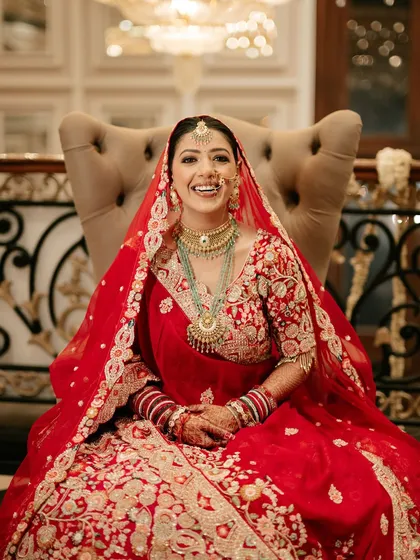 That priceless smile of a happy bride is what I live for. For Sona, we went with a classic red lehenga look, focusing on radiant skin and eyes that sparkle, making her look absolutely breathtaking in her wedding photos.