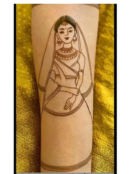A simple yet elegant portrait of a bride in her veil. This type of minimalist figure work is perfect for adding a personal touch to any part of a bridal mehandi design.