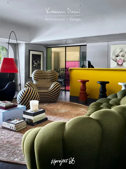 This is Project 86, a bachelor pad where we went all out. We mixed iconic pieces like the Roche Bobois Bubble couch with a bold yellow bar and pop art. This is how we create a living room that’s not just for living, but for making a statement.