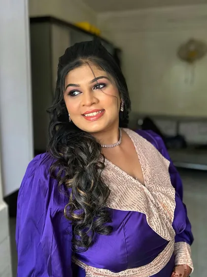 A vibrant purple smokey eye for a client who loves color. This look is fun and festive, perfect for a sangeet or music festival. The sequined lapel on her outfit adds to the glamorous feel.