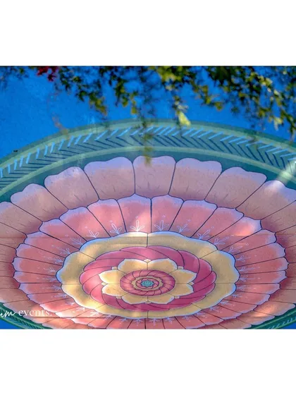 A direct look up at the custom-printed mandala ceiling of the mandap, a stunning and unique piece of art.