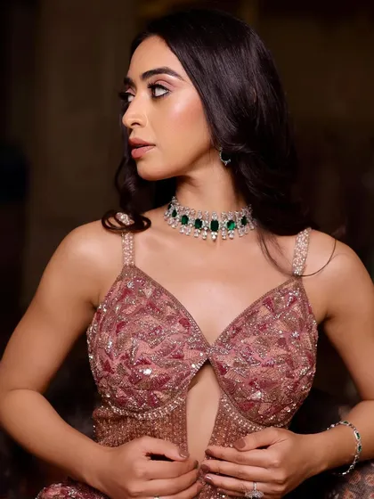 This look is all about soft glam for a cocktail event. The makeup is designed to feel elegant and polished, letting the statement jewelry shine.
