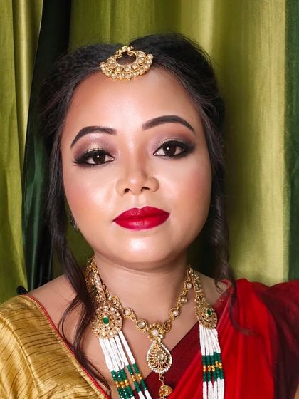 A close-up portrait of the bride, looking directly at the camera. Her eyes are the main focus of this look.