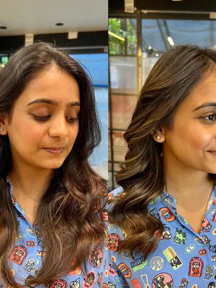 A happy client showing off her new caramel brown hair. The color brightens her complexion and gives her a fresh look.